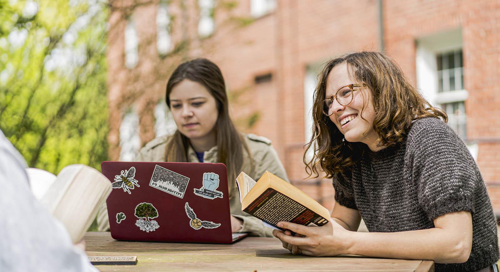 Photo of a group of Chatham University students studying outside on Shadyside Campus