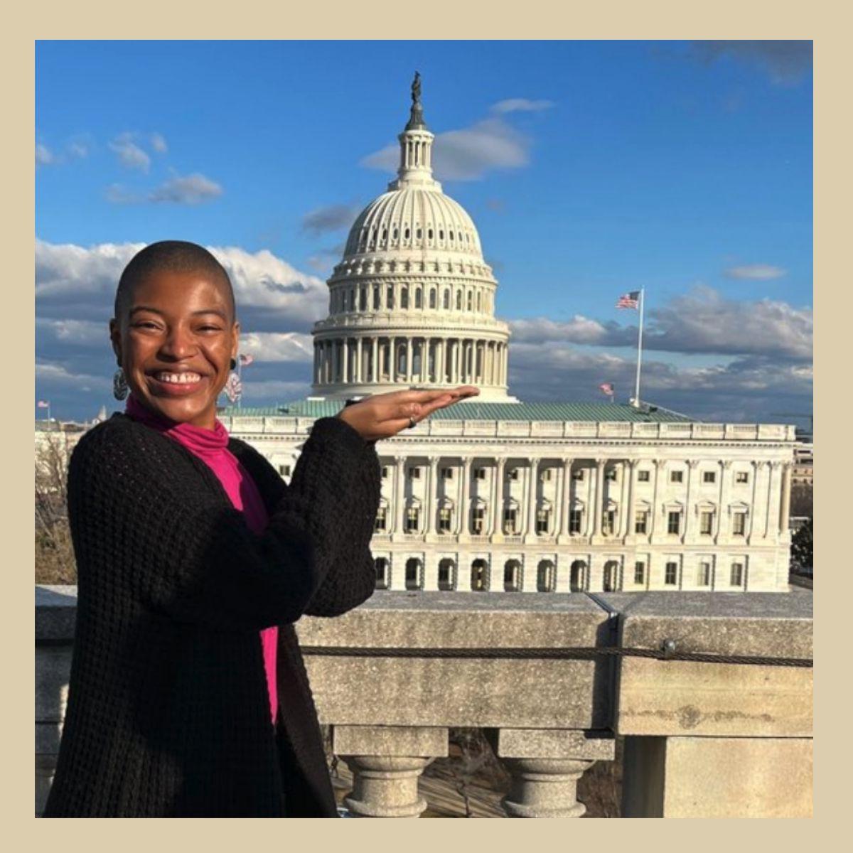 A smiling Lalah Williams in front of the United States Capitol building